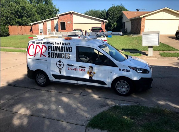 A CPR Plumbing service truck in a residential neighborhood