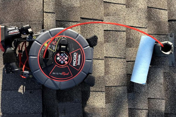 Plumbing camera being used on a residential roof