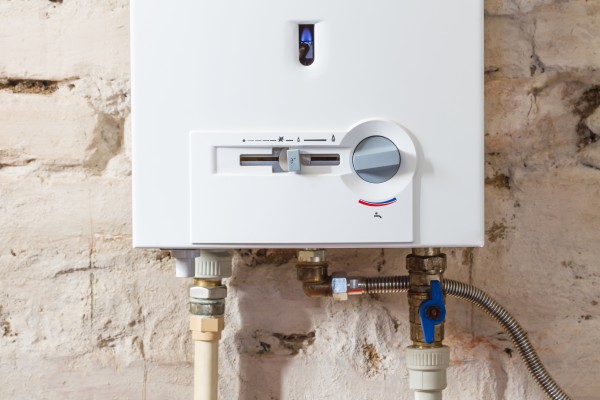 Tankless water heater on a brick wall