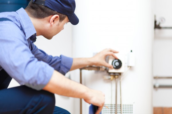 Plumber repairing an hot water heater